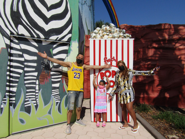 Zoe and Family in front of popcorn box