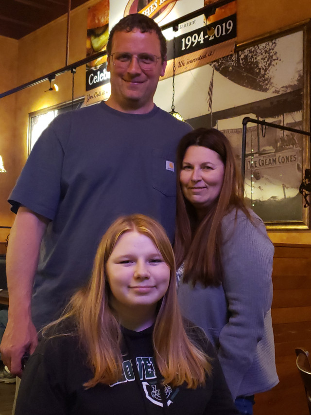 Isabel with Mom and Dad at Wish Presentation