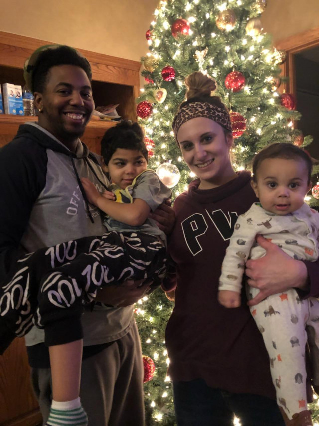 Kylen Family in Front of Xmas Tree Wish Pres