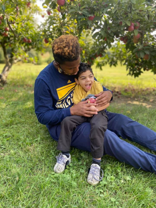 Kylens dad holding him on his lap