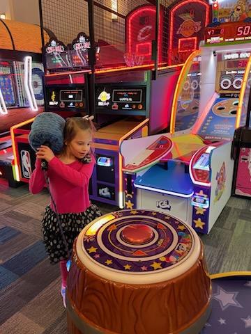 Clementine Playing Game with Hammer