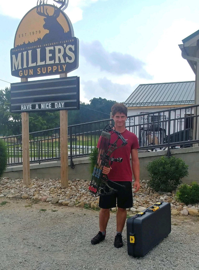 Arlen alone in front of store