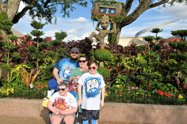 Blaine and Family in Front of Treehouse