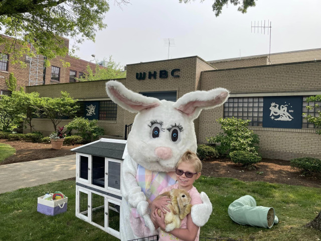 Hallie alone holding bunnies w Tracy GREAT pic