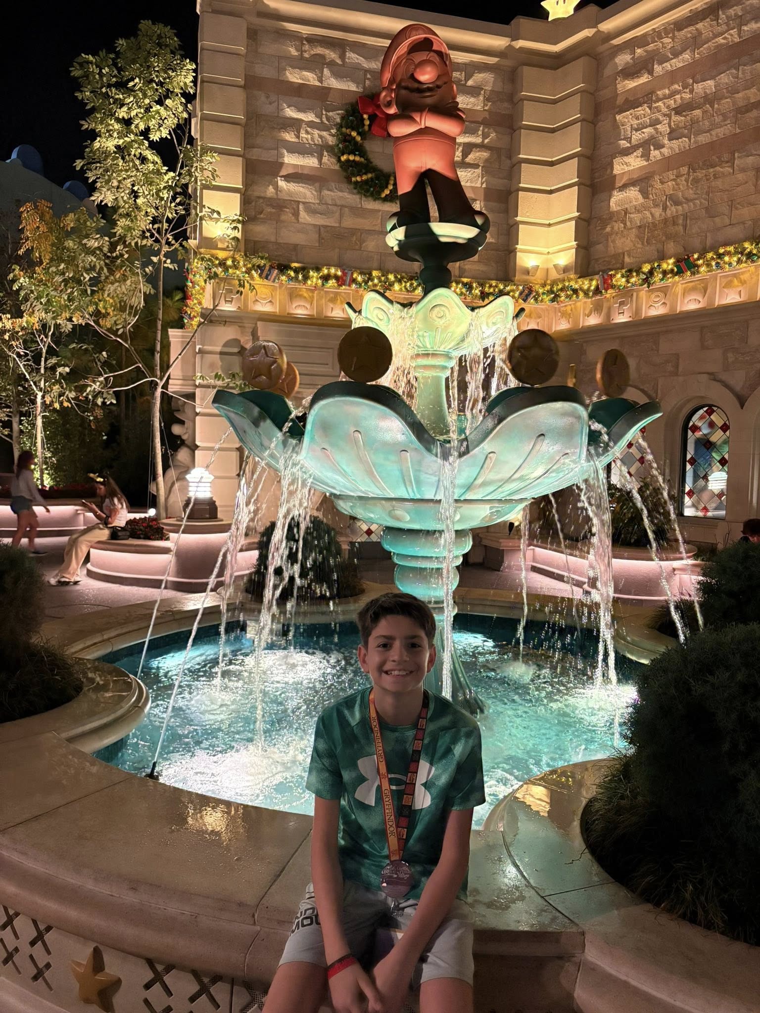 Micah with brothers at fountain