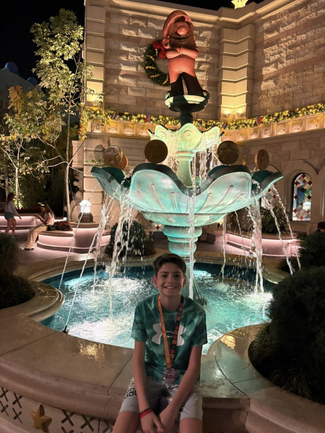 Micah with brothers at fountain