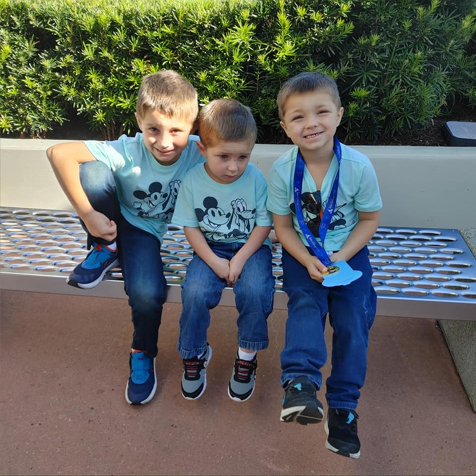 Boy chilaxin on bench at Disney