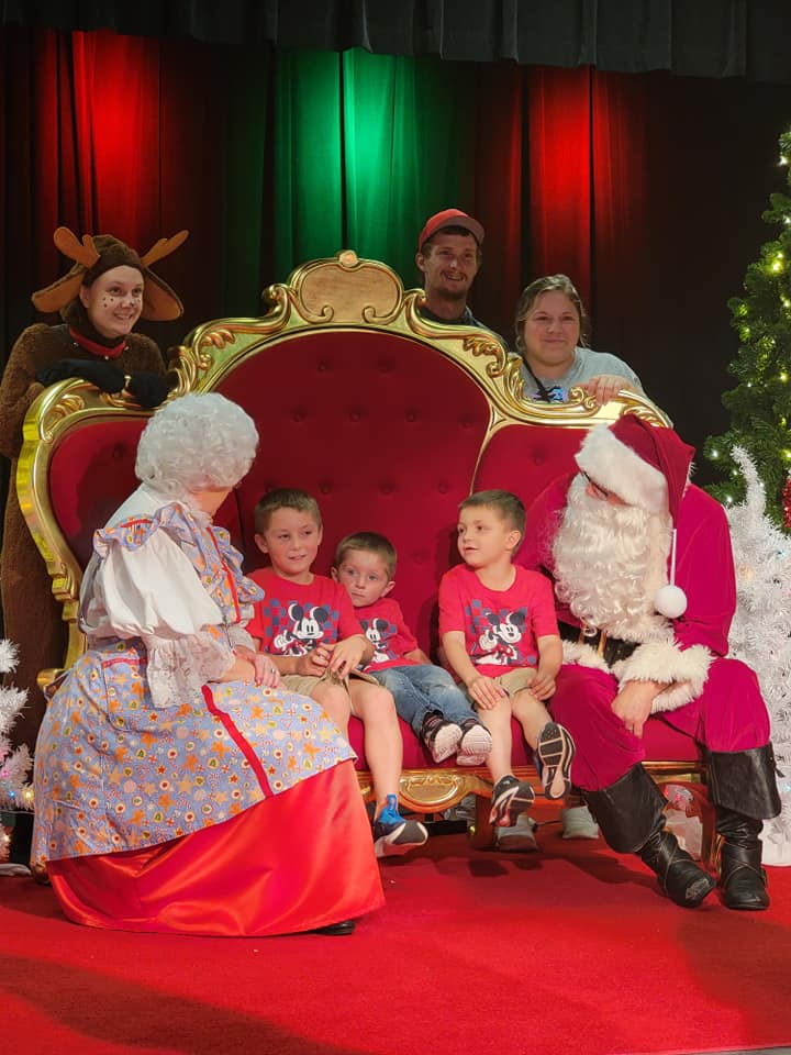 Family with Mr and Mrs Claus
