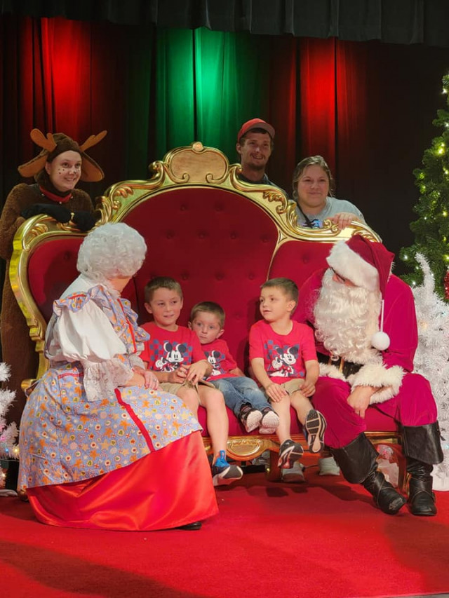 Family with Mr and Mrs Claus