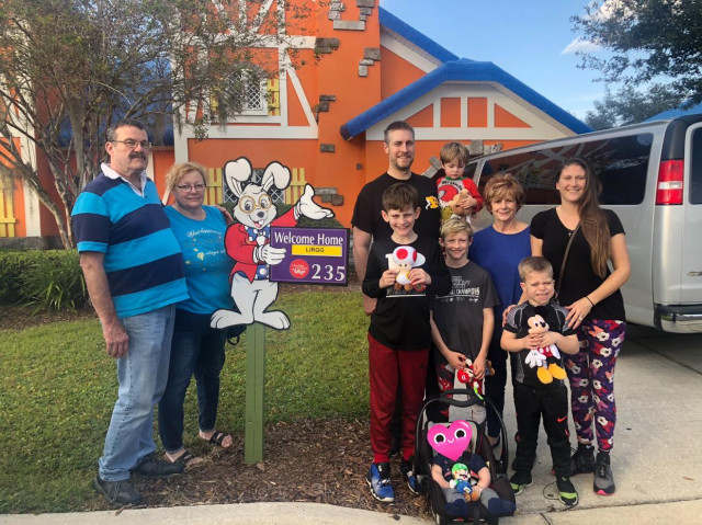 Blake Lirgg and Family in front of Villa