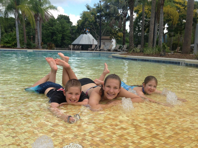 With sister in pool